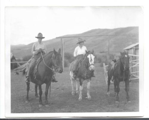 Untitled, two women on horseback with horse standing  by