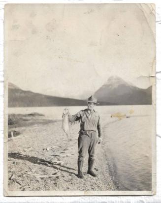 Untitled - man holding a fish